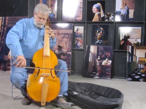 In his warehouse in San Antonio, Texas, Tim Jenison plays the viola de gamba he used to furnish his Vermeer room. (Photo by Tim Jenison, Courtesy of Sony Pictures Classics).