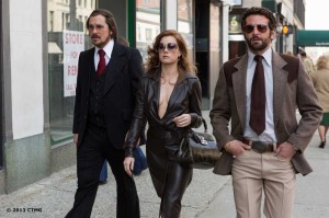 From left: Christian Bale, Amy Adams and Bradley Cooper in American Hustle.
