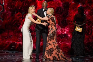 Catherine Martin accepts her award for costume design for work on The Great Gatsby from presenters Naomi Watts and Samuel L. Jackson. (Photo by: Michael Yada / ©A.M.P.A.S.).