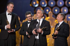 Christopher Benstead, Niv Adiri, Skip Lievsay, and Chris Munro accept the Oscar for achievement in sound mixing for work on Gravity. (Photo by: Michael Yada / ©A.M.P.A.S.)