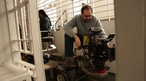 DP Antonio Rossi lining-up a shot using a Canon EOS C500 Cinema camera in a New York City prison. (Photo by Daniel Carter).