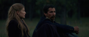 Rosamund Pike as Rosalie Quaid (left) and Christian Bale as Capt. Joseph Blocker (right)