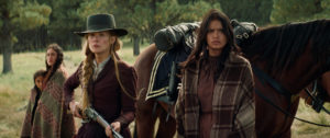 (Left to Right) Makayah Crowfoot as Apache Girl, Q'orianka Kilcher as Elk Woman, Rosamund Pike as Rosalie Quaid, Tanaya Beatty as Living Woman